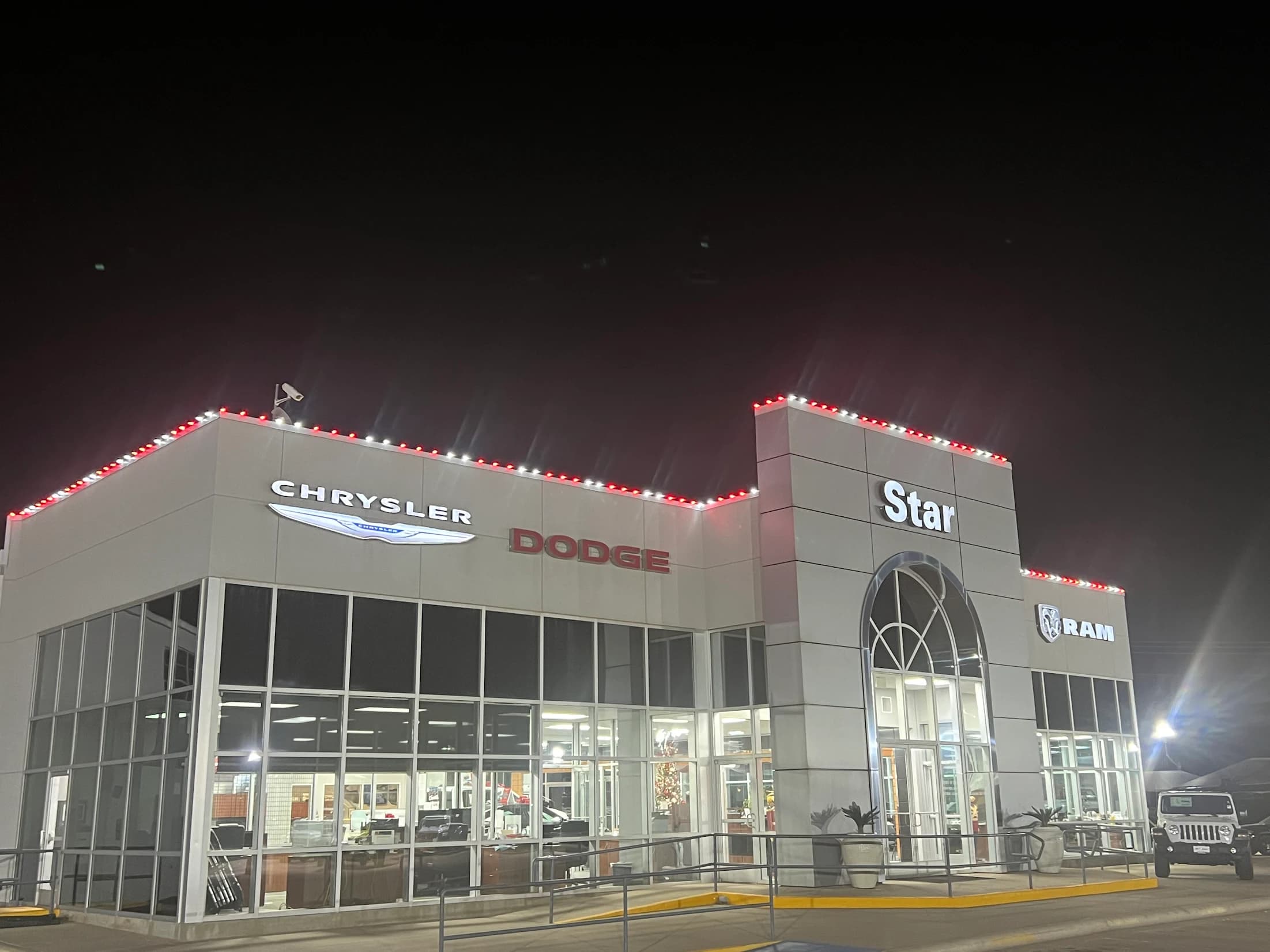 Commercial dealership outlined with professional Christmas lighting