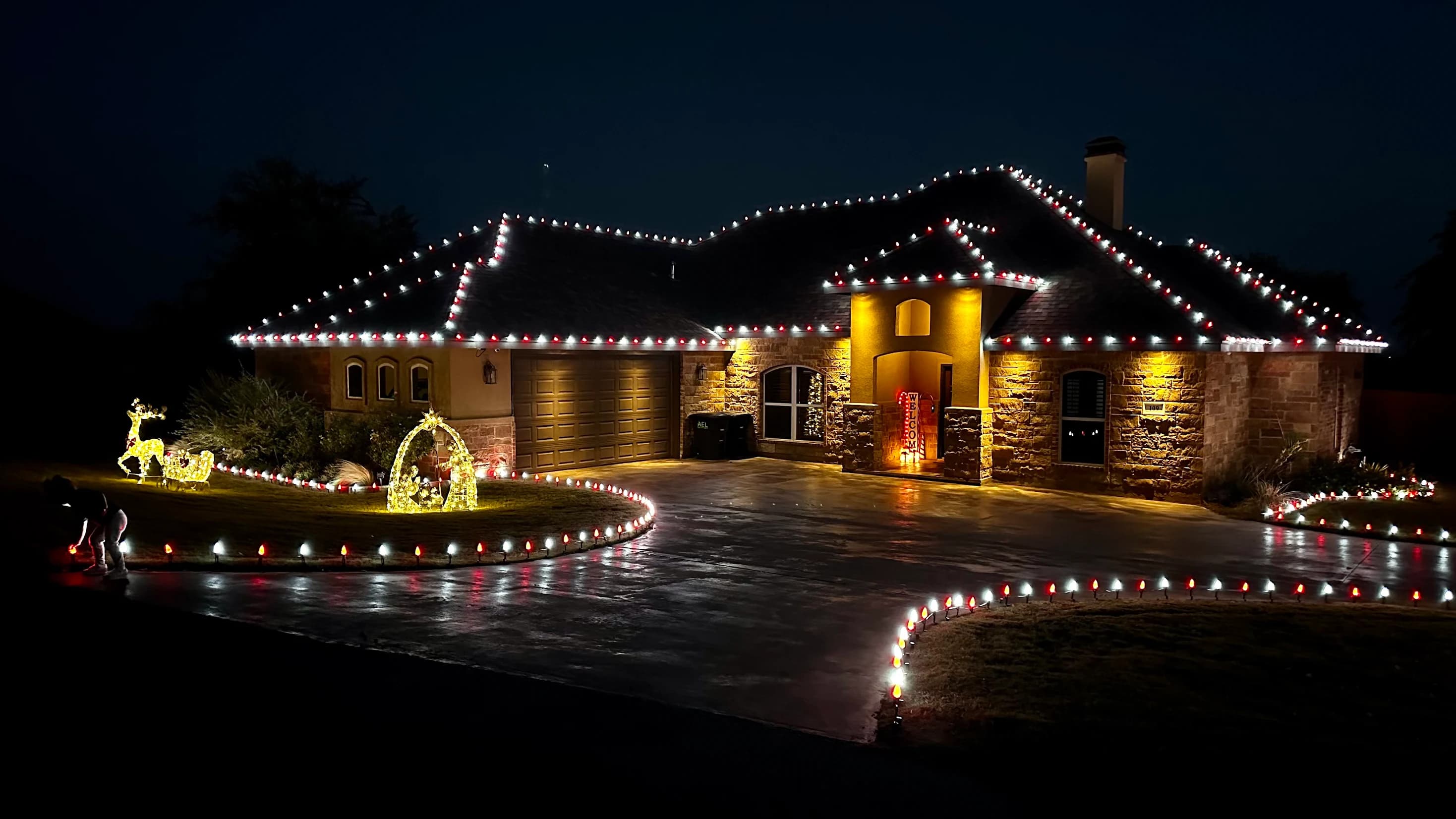 Large multicolor Christmas light display on a local home